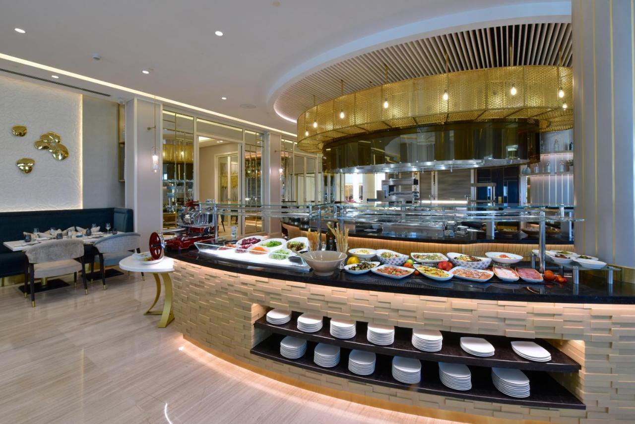 Moevenpick Hotel Bahrain Muharraq Extérieur photo The restaurant